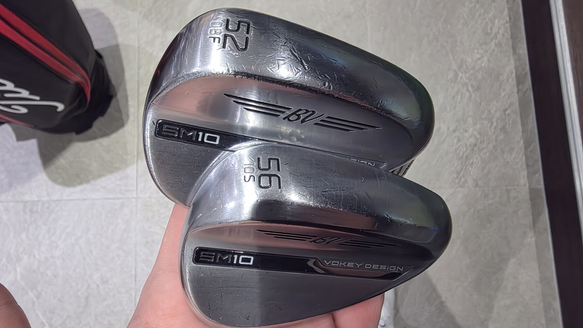 The author's Vokey SM10 wedges in 52 and 56 degrees, held face up.