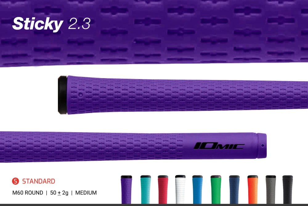 The Iomic Sticky 2.3 product image, a purple grip shown twice, once from the cap end and once with the IOMIC name, with a strip at the bottom reading Standard, M60 round, 50 plus or minus 2 g, medium, and ten color options in a row.
