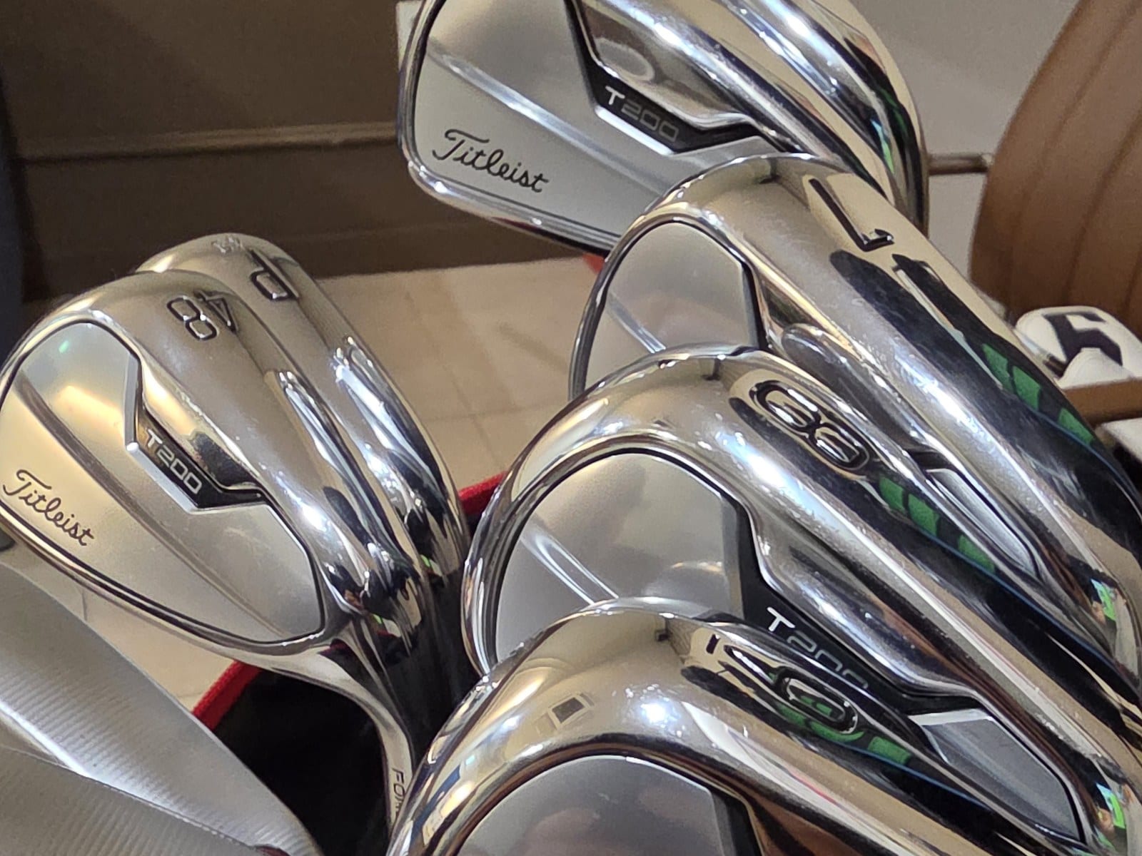 Titleist T200 iron heads in a bag, showing the T200 badge, the P and the 48 degree gap wedge.