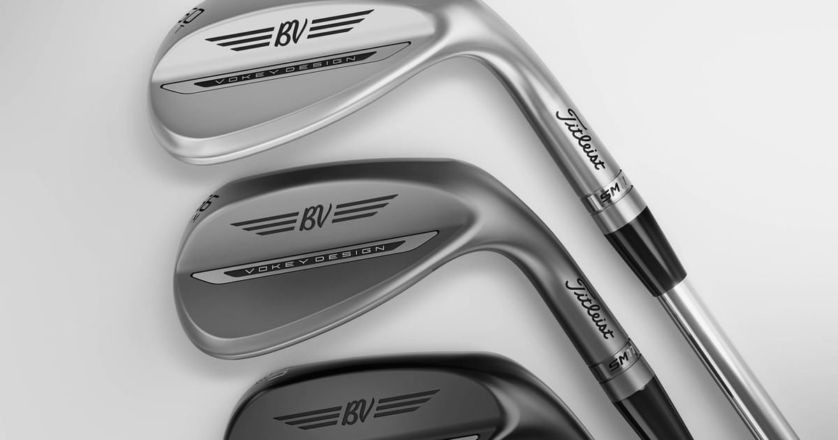 Three Titleist Vokey SM11 wedges lying face down in a row, chrome, nickel and black, with the soles and Titleist shaft bands facing the camera.